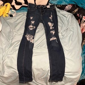 Holdover jeans with holes
